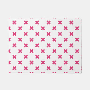 Fuchsia cross stitches on white doormat