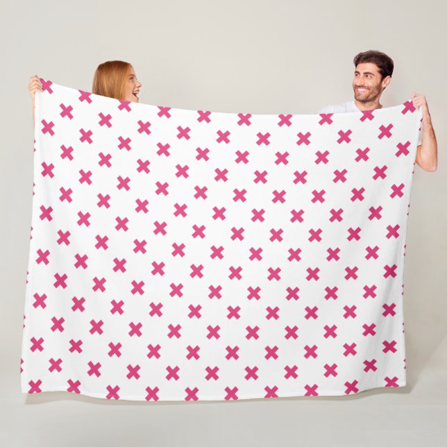 Fuchsia cross stitches on white fleece blanket (In Situ)