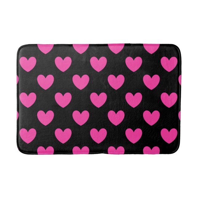 Fuchsia pink polka hearts on black bath mat (Front)