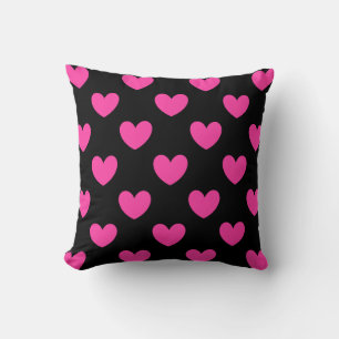 Fuchsia pink polka hearts on black cushion