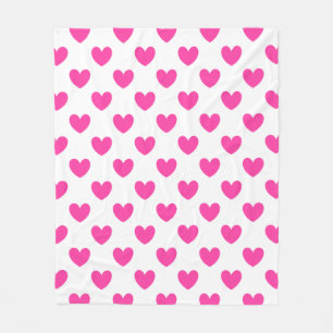 Fuchsia pink polka hearts on white fleece blanket