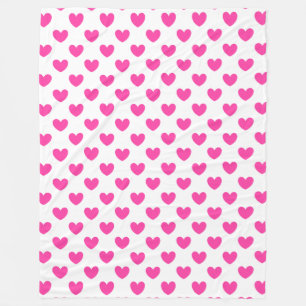 Fuchsia pink polka hearts on white fleece blanket