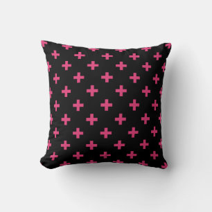 Fuchsia polka crosses on black cushion