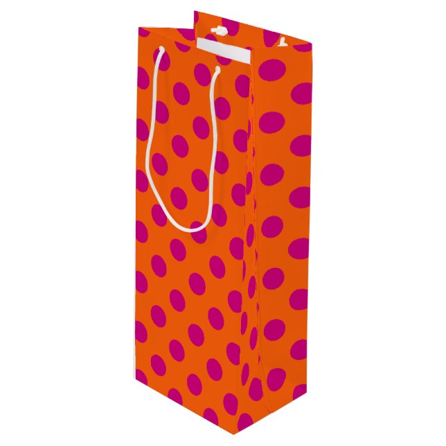 Fuchsia polka dots on orange wine gift bag (Front Angled)