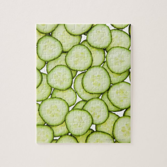 Full frame of sliced cucumber, on white jigsaw puzzle (Vertical)
