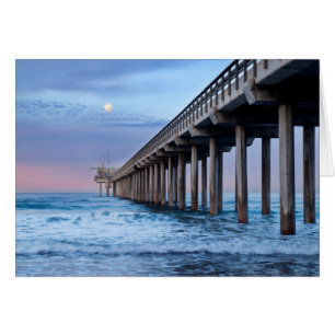Full moon over pier, California