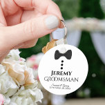 Fun Black Tie Tuxedo Groomsman Wedding Favour Key Ring<br><div class="desc">This cute keychain is designed as a gift for your groomsmen. Features a fun design with a black bow tie and buttons on a white background. The text reads "Groomsman" with a place for his name, along with the names of the wedding couple & the date. Great way to thank...</div>