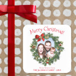 Fun Christmas Wreath Picture Frame Cute Holiday Square Sticker<br><div class="desc">These adorable stickers make great gift tags. They feature a cute design with your photo appearing in the centre of a holiday wreath. The heating reads Merry Christmas in a whimsical fun red font. There is space for a short greeting,  along with your name and the year.</div>
