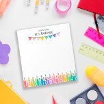 Fun Coloured Pencils Note From School Teacher<br><div class="desc">A note from School Teacher notepad personalised with the teacher's name above colourful bunting banners and a row of coloured pencils, some with patterns, in soft rainbow colours. Kindergarten teacher notepad with colourful pencils and a bunting flag banner in soft shades of the rainbow, with some patterns like stripes, dots,...</div>