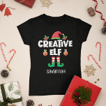 Fun Creative elf with name Christmas family T-Shirt<br><div class="desc">Perfect for any Christmas family gathering, this fun t-shirt features a cute elf hat and tiny legs, with the caption "Creative elf" in a contemporary white all-caps font. This hilarious self-ironic joyful elf t-shirt, which is a part of a matching family elf clothing collection with gifts for every family member,...</div>
