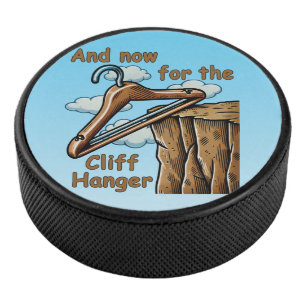 Fun Image of Cliff Hanger with Playful Wordplay Hockey Puck