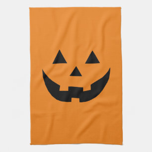 Fun orange jack o lantern pumpkin face Halloween Tea Towel