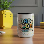 Fun Retro Pixel Level Up Dad Gamer Player  Mug<br><div class="desc">Level up Dad’s morning routine with this fun retro gamer-themed coffee mug! Featuring an 8-bit pixel design and bold “Dad Mode” typography, it’s packed with classic gaming elements — health bars, achievements, battery life, and a loading bar. Add a personal touch by customising it with your photo inside the “O”...</div>