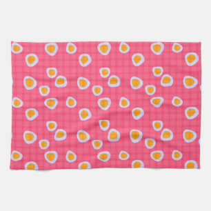 Fun spots on a coral pink checkered background tea towel