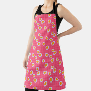 Fun spots on a coral pink chequered background apron
