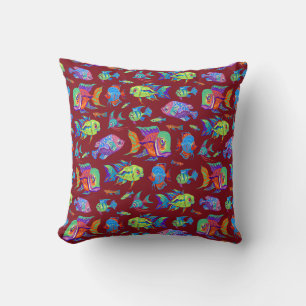 Fun tropical fishes on dark red cushion