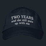 Funny 2 Year Anniversary Husband Hat Gift Cap<br><div class="desc">2nd wedding anniversary gift for him says 2 years and she still puts up with me on an embroidered ball cap hat for men celebrating two years together.</div>