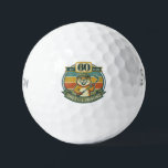 Funny 60th Birthday Golf Balls<br><div class="desc">Celebrate turning 60 with a laugh on the golf course! These funny 60th birthday golf balls feature a goofy “Still Swinging After All These Years” design with 60 printed right on the ball. Perfect for golfers who know that age is just a number—especially when the swing is still going strong....</div>