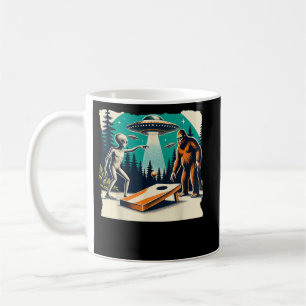 Funny Alien Playing cornhole Bigfoot And UFO Coffee Mug