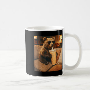 Funny animal bear drinking iced coffee on couch mug