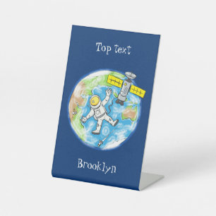 Funny astronaut in space and earth cartoon pedestal sign