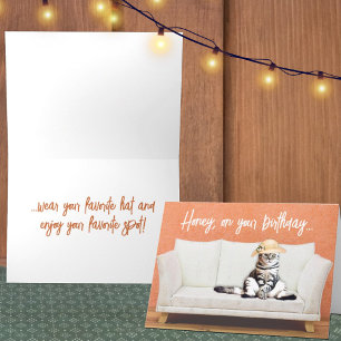Funny Cat Wearing a Sun Hat on a Couch Birthday Card
