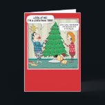 Funny Christmas Tree Dim Bulb Holiday Card<br><div class="desc">Here's a cute and funny cartoon Christmas card featuring a woman who is dealing with a dim bulb as she and her husband (and dog) are decorating the Christmas tree. Thank you for choosing this original design by © Chuck Ingwersen. I’m an independent artist, and I post cartoons almost every...</div>