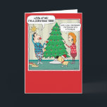 Funny Christmas Tree Dim Bulb Holiday Card<br><div class="desc">Here's a cute and funny cartoon Christmas card featuring a woman who is dealing with a dim bulb as she and her husband (and dog) are decorating the Christmas tree. Thank you for choosing this original design by © Chuck Ingwersen. I’m an independent artist, and I post cartoons almost every...</div>