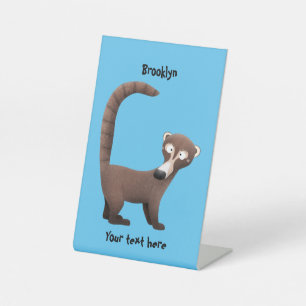 Funny curious coatimundi cartoon illustration pedestal sign