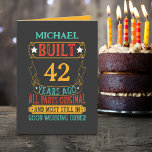 Funny Custom Name and Years Birthday  Card<br><div class="desc">This birthday greeting card features a vibrant and playful design on a black background. The front of the card showcases a custom name followed by bold and colourful text that reads: "BUILT (custom number of years) YEARS AGO" prominently displayed in a mix of red, yellow, and blue colours. Below the...</div>