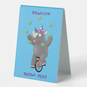 Funny cute rhino juggling on unicycle