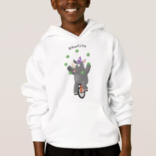 Funny cute rhino juggling on unicycle