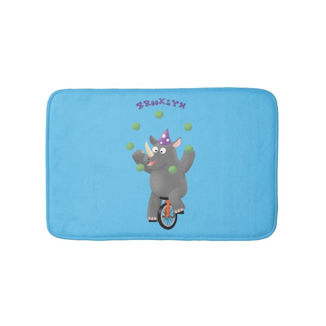 Funny cute rhino juggling on unicycle bath mat (Front)