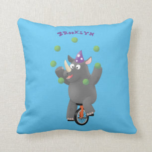 Funny cute rhino juggling on unicycle cushion