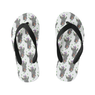 Funny cute rhino juggling on unicycle kid's thongs