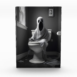Funny ghost sitting in toilet photo block