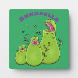 Funny green carnivorous pitcher plants cartoon plaque