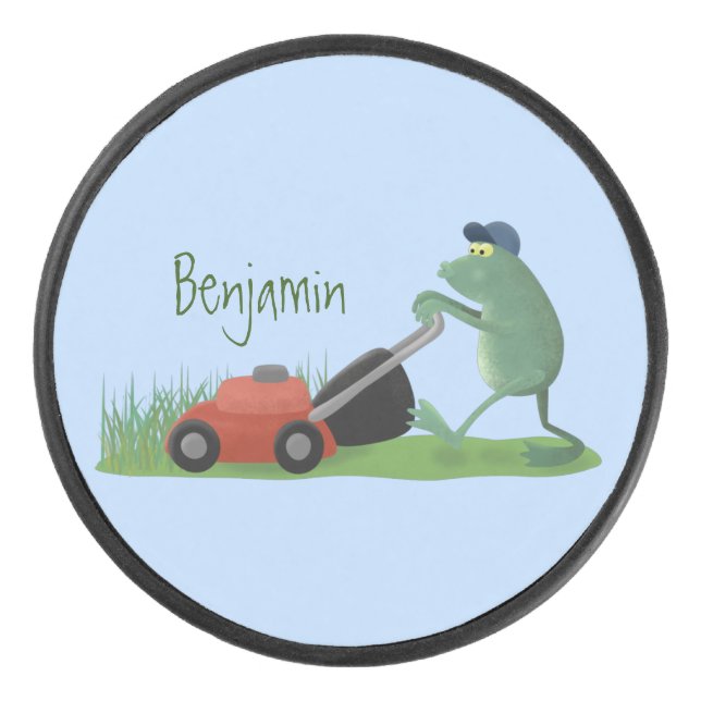 Funny green frog mowing lawn cartoon hockey puck (Front)