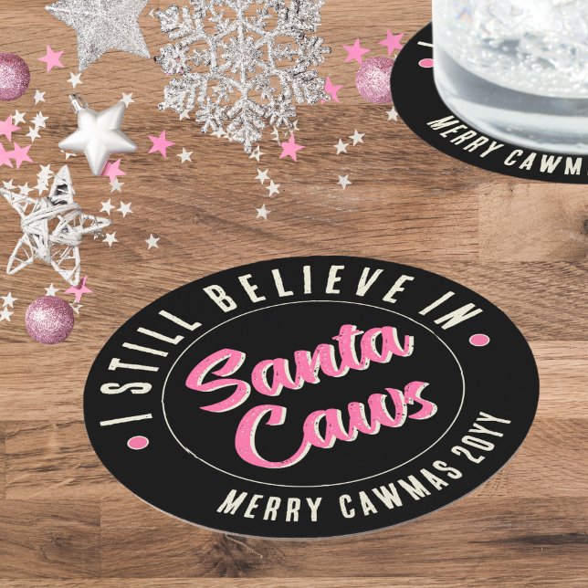 Funny I Believe in Santa Caws Christmas Party Round Paper Coaster (Fun pink and black pinkmas Christmas party coaster with custom text celebrate Santa Caws the crow.)