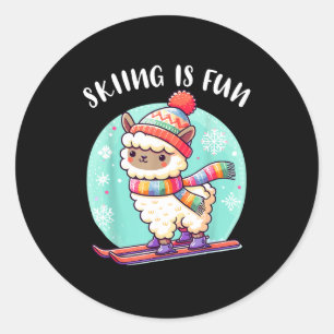 Funny llama with hat and scarf loves skiing in the classic round sticker
