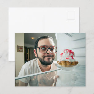 Funny man looking in refrigerator postcard