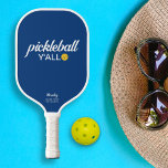 Funny Pickleball Y'all Custom Text Name Pickleball Paddle<br><div class="desc">Hey Y'all, let's all play pickleball! This funny pickleball paddle reads "pickleball y'all" in a bold white text that's set against a blue background and highlighted by a yellow pickleball (you can easily change the background colour). Add 2 lines of custom text to personalise - club name, location, player's name,...</div>