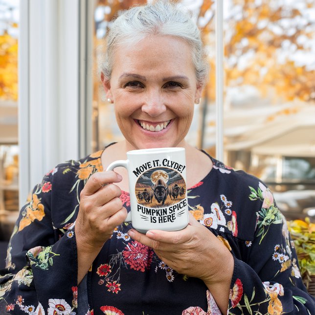 Funny Pumpkin Spice Bison Herd Stampede  Coffee Mug (woman enjoying coffee from a funny pumpkin spice mug in an autumn setting)