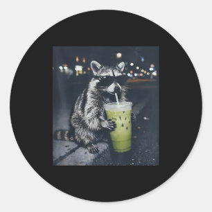 Funny raccoon drinking iced matcha latte animal classic round sticker