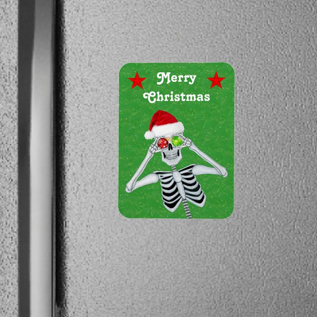 Funny Skeleton Christmas Ornaments Stars Green Magnet (Silly Skeleton ornament Eyes Santa hat red Stars on green Christmas flexible magnet.)