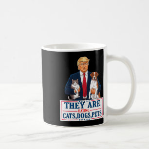 Funny They Are Eating The Dogs The Cats The Pets T Coffee Mug
