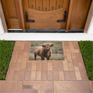 **"Furry Majesty: The Woolly Brown Highland Cow"** Doormat