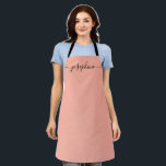 Fuzzy Peach Trendy Elegant script Name Apron<br><div class="desc">She'll love a personalised apron as she bakes those goodies,  cooks delicious dishes or work with her plants. A perfect gift to encourage her talents. Black script for the name with long-tail embellishments. Fuzzy Peach colour.</div>