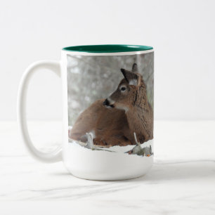Fuzzy White Tailed Deer Fawn resting in snow Two-Tone Coffee Mug