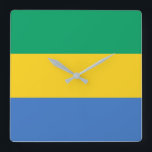 Gabon Flag Square Wall Clock<br><div class="desc">The Gabonese flag is a horizontal triband. The used colours in the flag are blue,  green,  yellow. The proportion of the Gabonese flag is 3:4. The Flag of Gabon was adopted in 1960.</div>